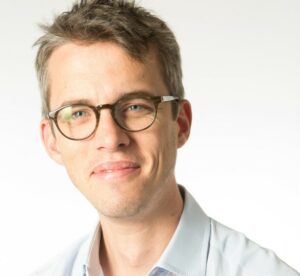 WHite man wearing glasses