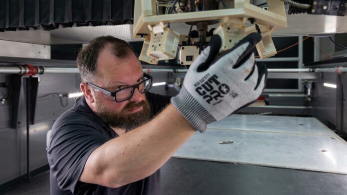 2025-P11626 ORNL’s Kris Villez adjusts thermal cameras incorporated into a big-area 3D printer before testing a new technology for error recognition and correction. Credit: Alonda Hines/ORNL, U.S. Dept. of Energy