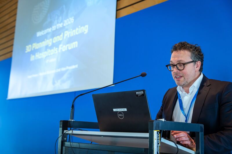 Man giving a speech to open a conference