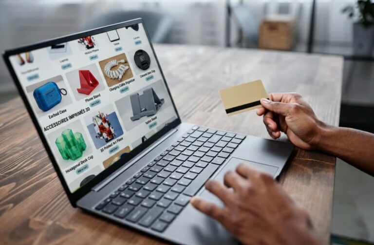 A laptop displaying an online catalogue of products.
