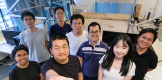 Image: NTU Prof Hirotaka Sato (2nd from left), pioneer of the cyborg insect technology, holding a cyborg Madagascar hissing cockroach with the new diving suit, which has an oxygen generator, enabling the insect to survive underwater for three hours.