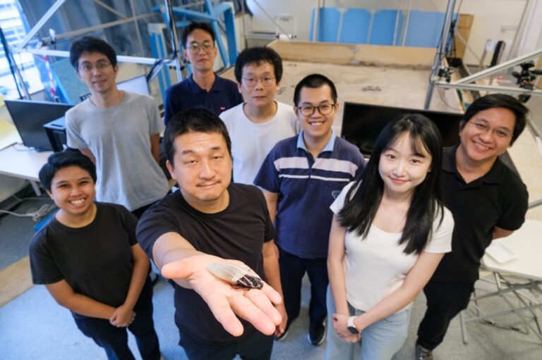 The NTU research team presenting a cyborg insect.