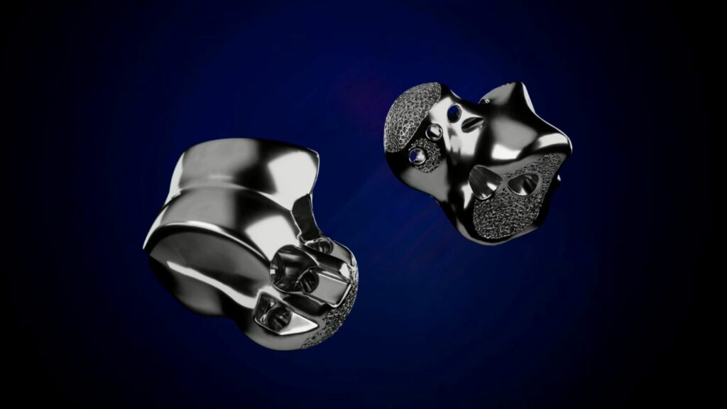 Two metallic orthopaedic implants against a blue background.