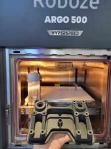 Roboze ARGO 500 Hyperspeed printer with a part inside its chamber.