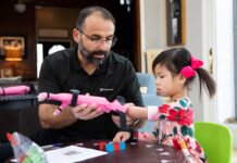Jorge M. Zuniga, Ph.D, helps Rue Gillespie put on her prosthesis before she is run through a series of tests on Wednesday, Jan. 15, 2020, in Omaha, Nebraska, at the Gillespie home. (Ryan Soderlin/UNO) Jorge M. Zuniga, Ph.D, helps Rue Gillespie put on her prosthesis before she is run through a series of tests on Wednesday, Jan. 15, 2020, in Omaha, Nebraska, at the Gillespie home. (Ryan Soderlin/UNO)