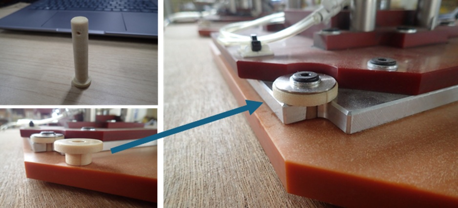 Printed spacer supporting a metal component in a fixture.