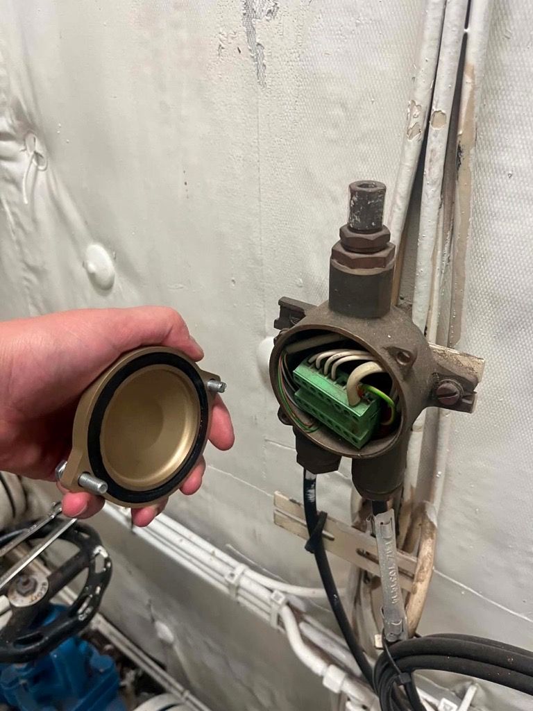 An Aluminium Bronze Cover Box printed and machined using the UTK DARC & TNARNG SPEE3D Expeditionary Manufacturing Unit (EMU) reach back capability and then installed on the MV Asterix during RIMPAC 2026, an exercise organised by CAMRE NPS.