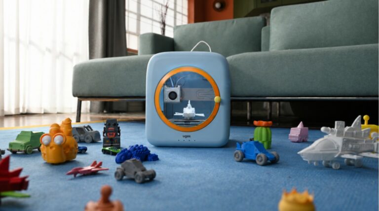 ugee Funbox desktop 3D printer displayed with colourful printed models.